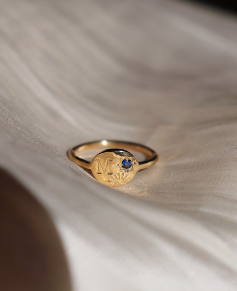 Sun and star initial ring with birthstone