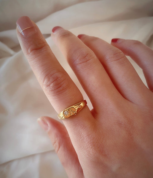 Signet initial ring with one birthstone