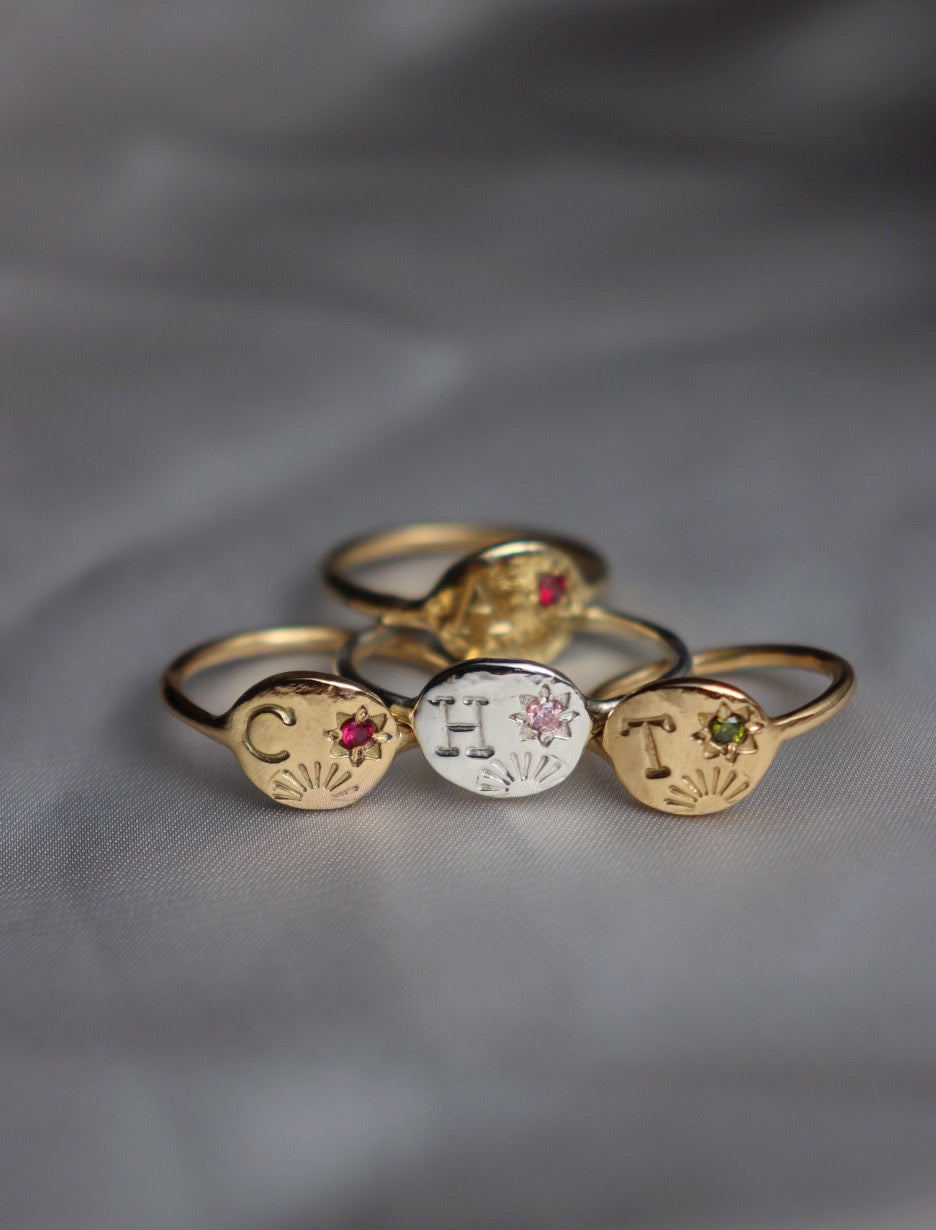 Sun and star initial ring with birthstone