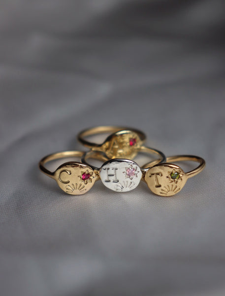 Sun and star initial ring with birthstone